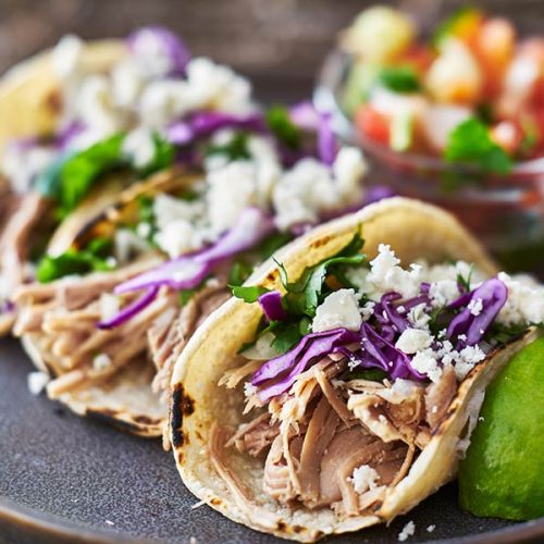 bigstock-Street-tacos-with-carnitas-225381346.jpg